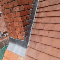 Repaired the lead flashing on a chimney